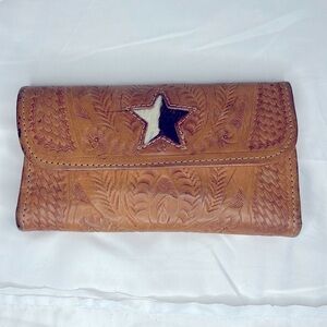 Brown Leather and fur embossed floral design wallet. Holds 12 cards.